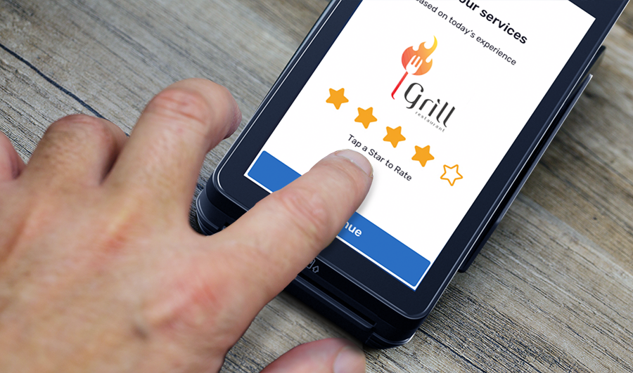 Guest leaving a star rating on a Shift4 Dine device